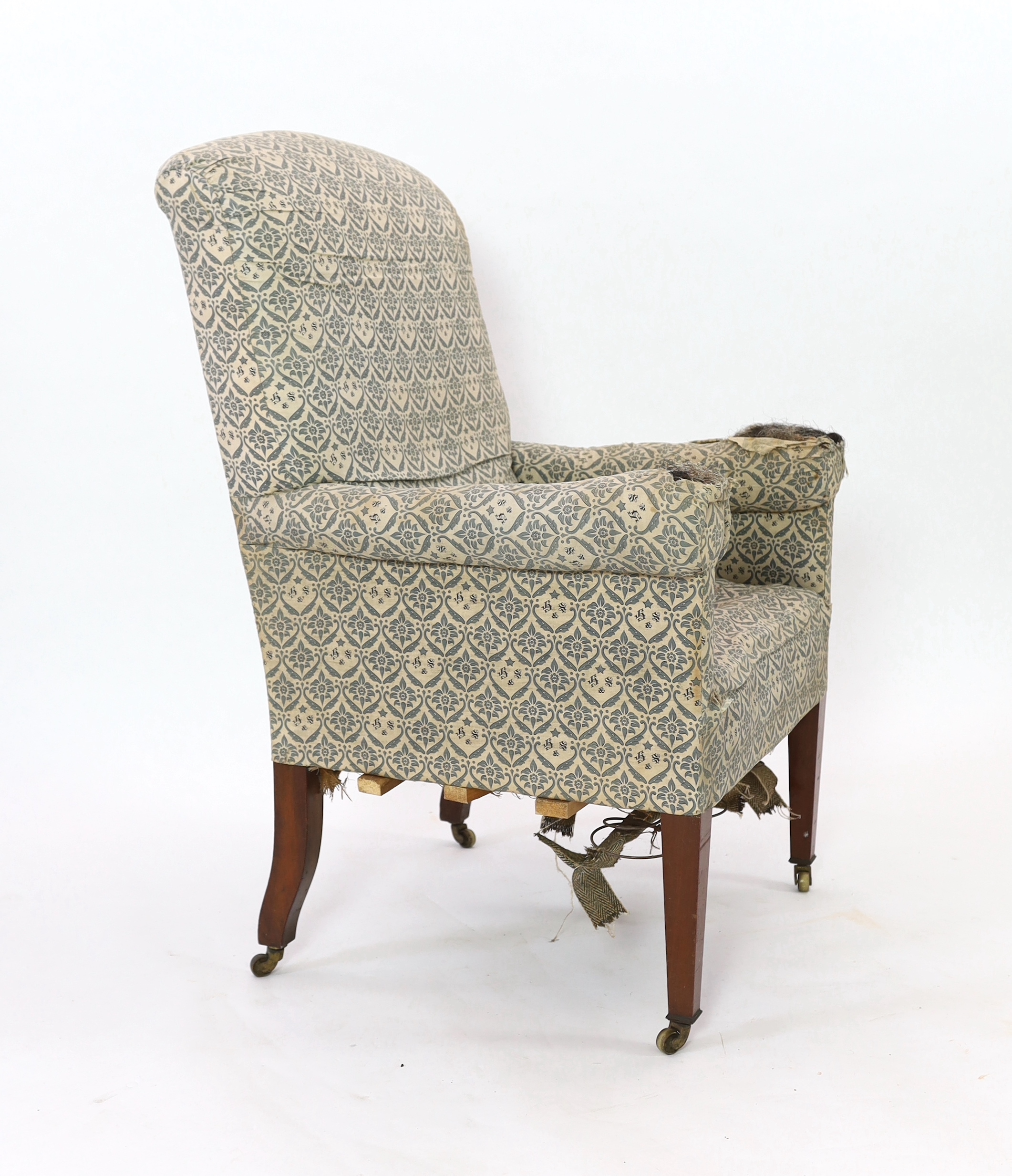 A late Victorian Howard & Sons armchair, width 80cm, depth 80cm, height 115cm